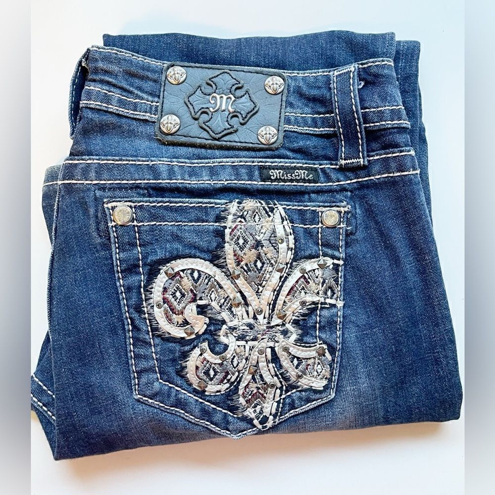 Miss Me bootcut Jeans with embellished Fluer de Lis on pocket and crystals. 29